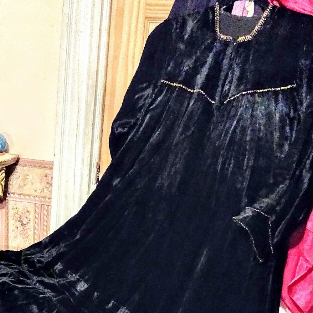Long black velvet dress with gold studded trim